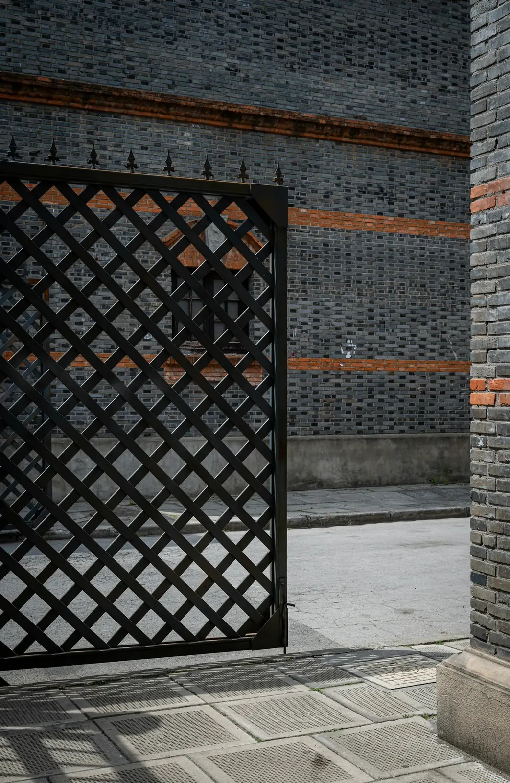 Entry Gates Louisville, KY, modern black gate opening onto a street