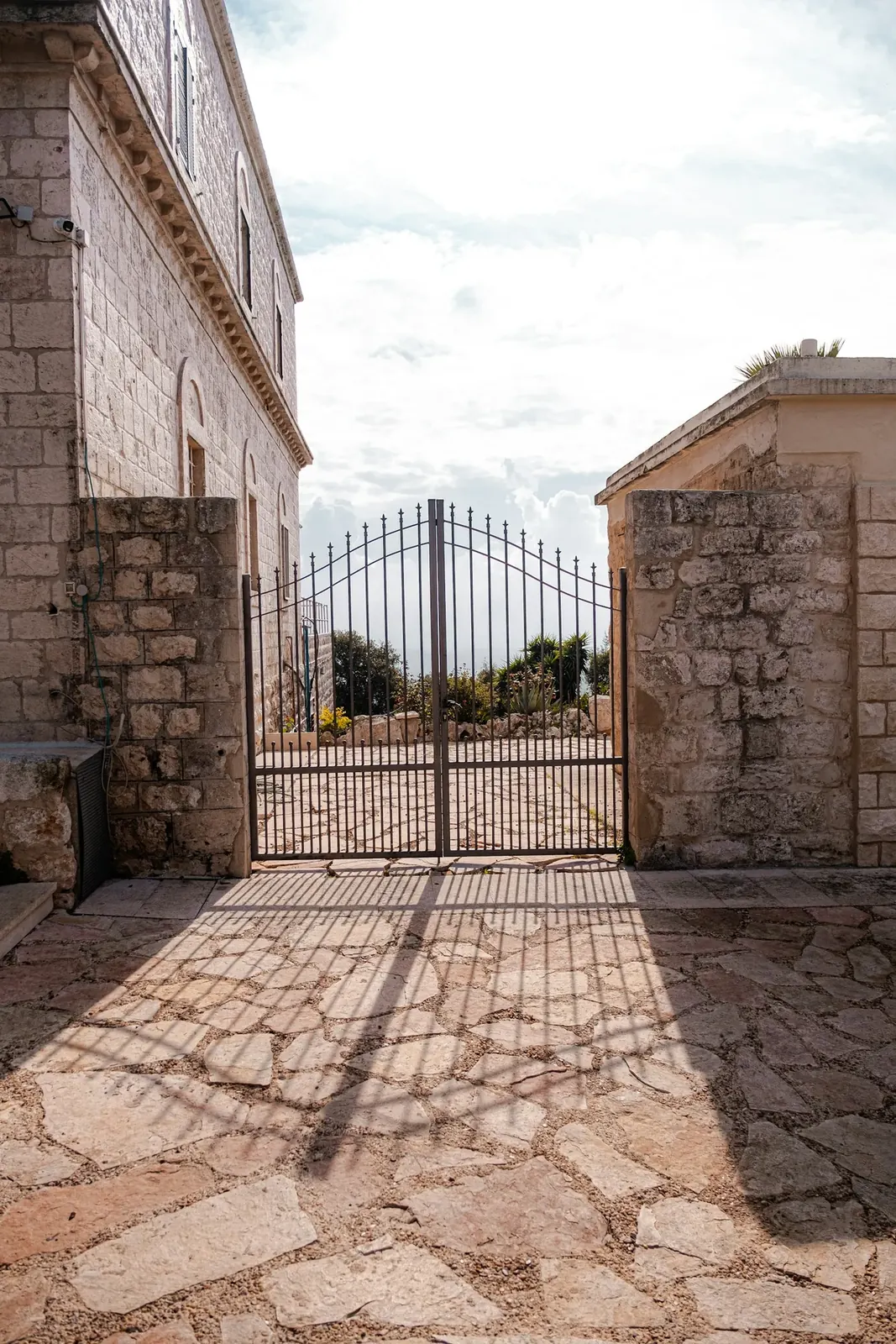 Courtyard Gates Louisville, KY, modern gate in a stone courtyard